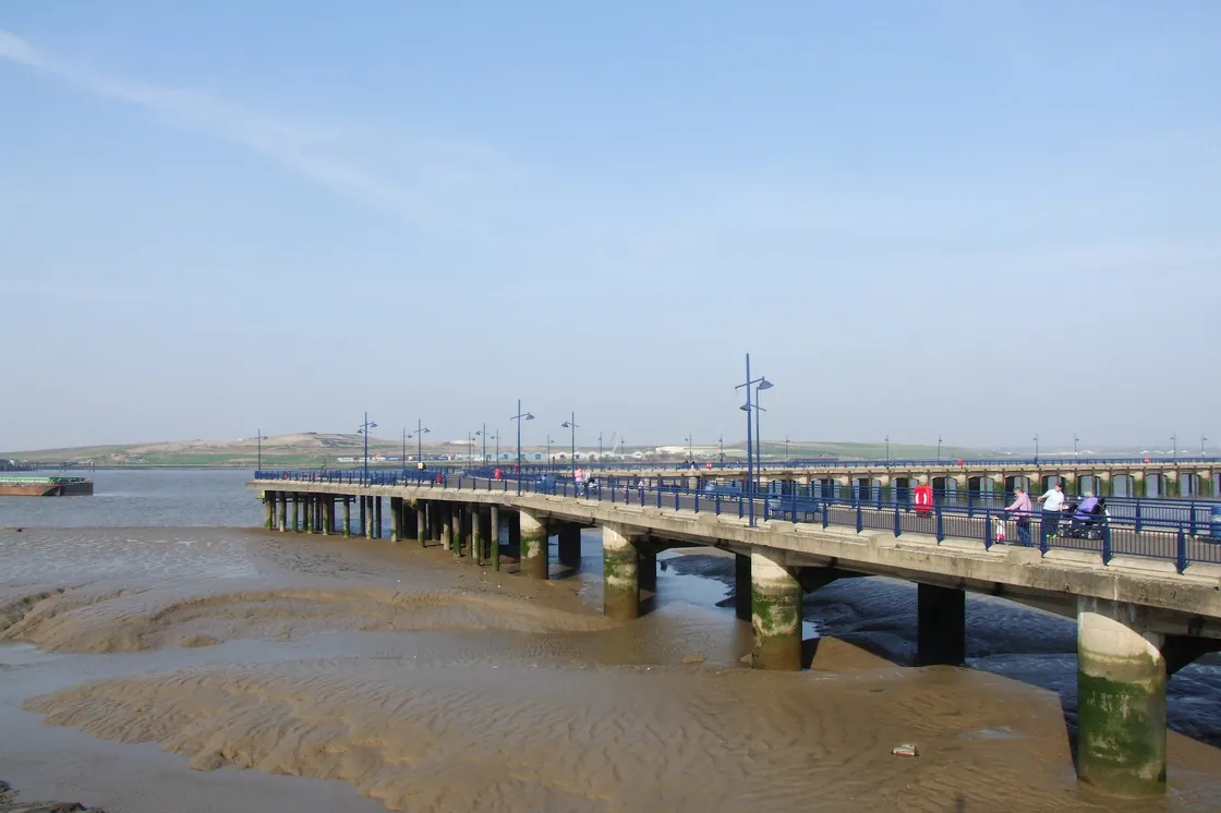 Erith Pier reaching over the Thames at low tide